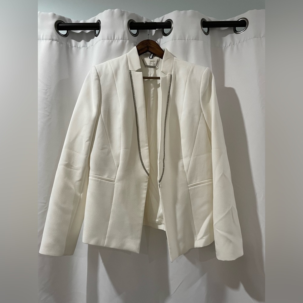 White House black market white blazer with metal trim.